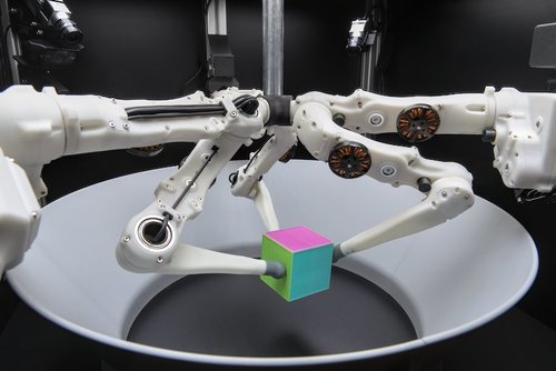 A Robot Cluster for Reproducible Research in Dexterous Manipulation